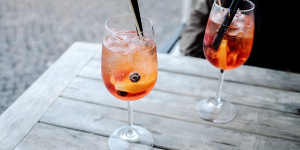 two cocktails on a wooden table