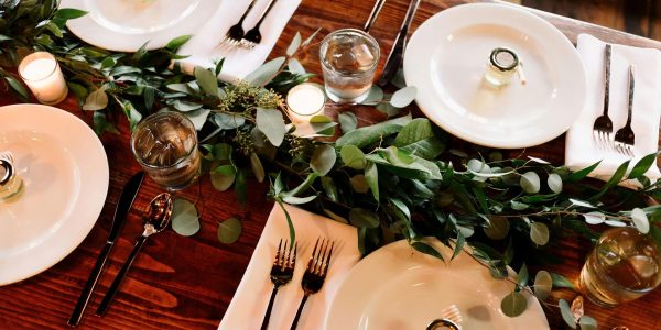 A variety of plates at a table for a wedding